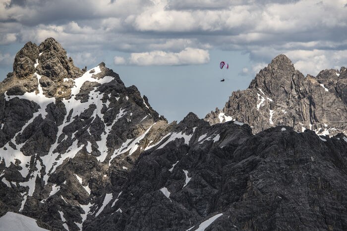 Aaron Durogati (ITA1) races during the Red Bull X-Alps above  Imst, Austria on June 19, 2019.