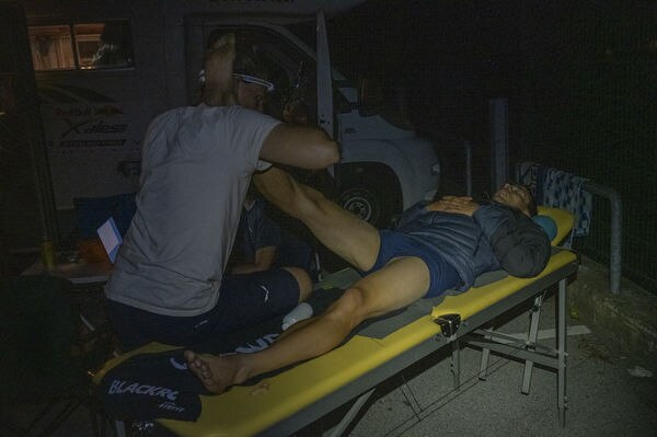 GER2 resting during Red Bull X-Alps in Taxenbach, Austria on June 20, 2021 Markus Anders receiving a treatment on the end of day 1 of the race. © zooom / Adi Gaisegger