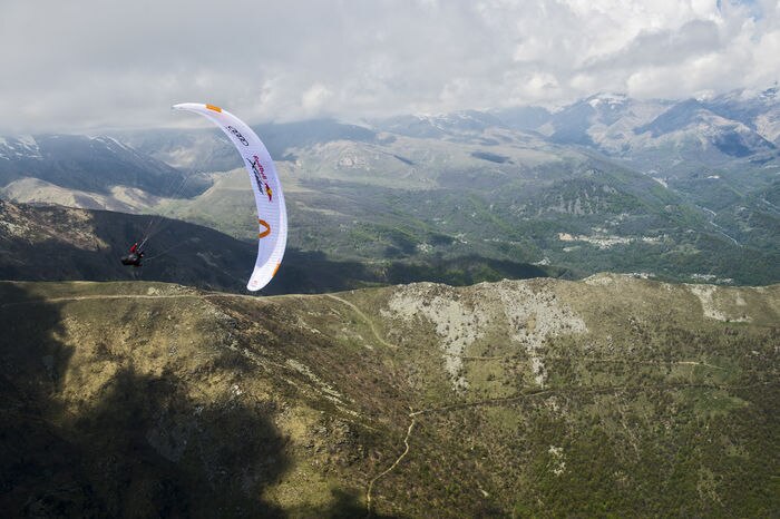 Participant flies during the Red Bull X-Alps preparations in Paesana, Italy on may 22, 2019