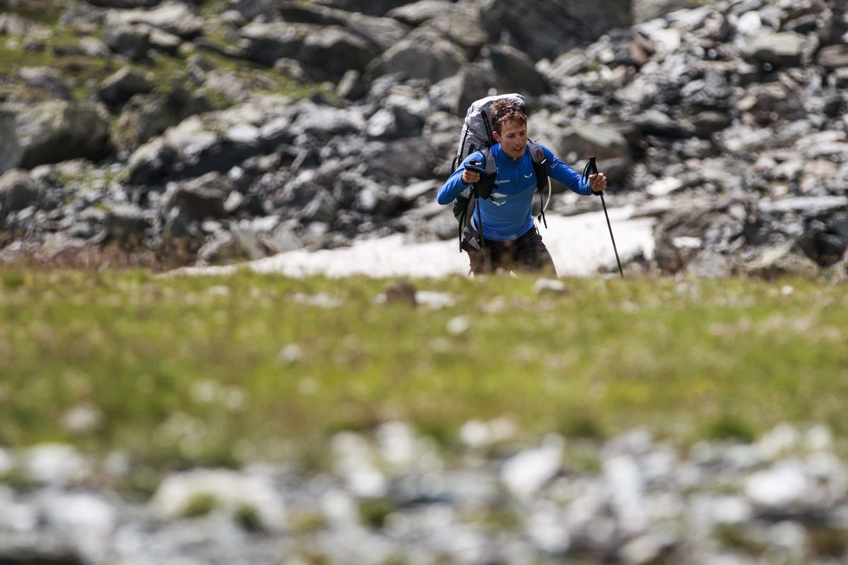 Simon Oberrauner (AUT4) hikes during the Red Bull X-Alps in Staffal, Italy on July 11, 2017