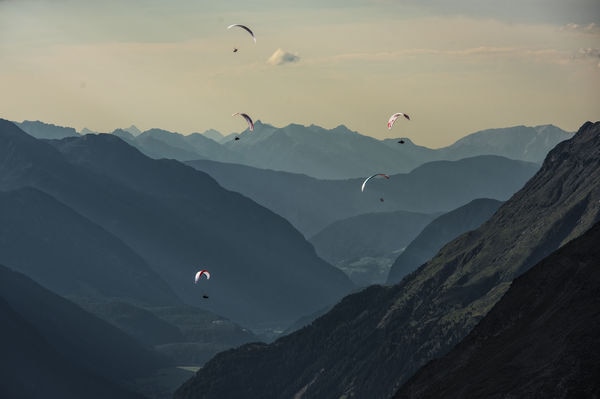 Athletes fly during the Red Bull X-Alps at the Timmelsjoch, Austria on July 6, 2017.