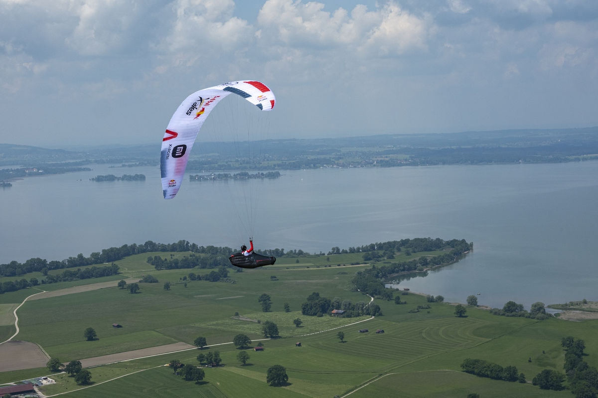 Participant flies during the Red Bull X-Alps preparations at Achendelta, Chiemsee, Germany on June 09, 2021