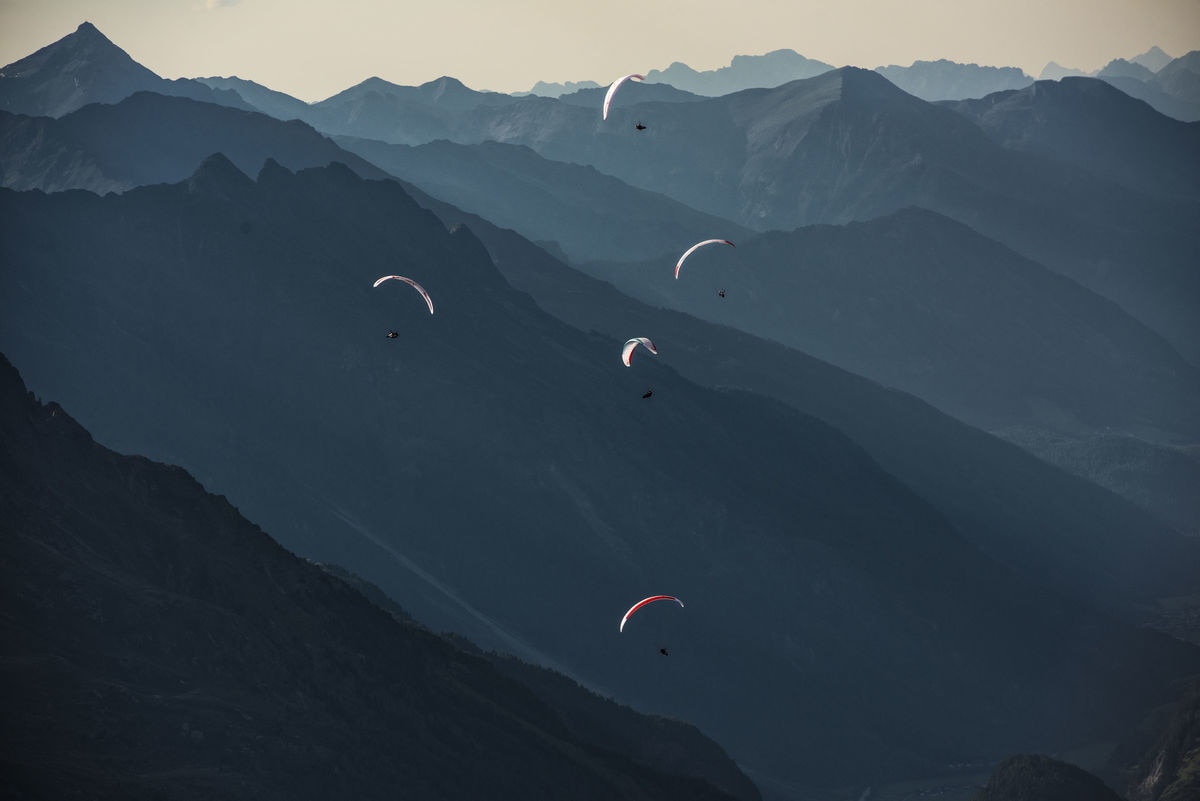 Athletes fly during the Red Bull X-Alps at the Timmelsjoch, Austria on July 6, 2017.