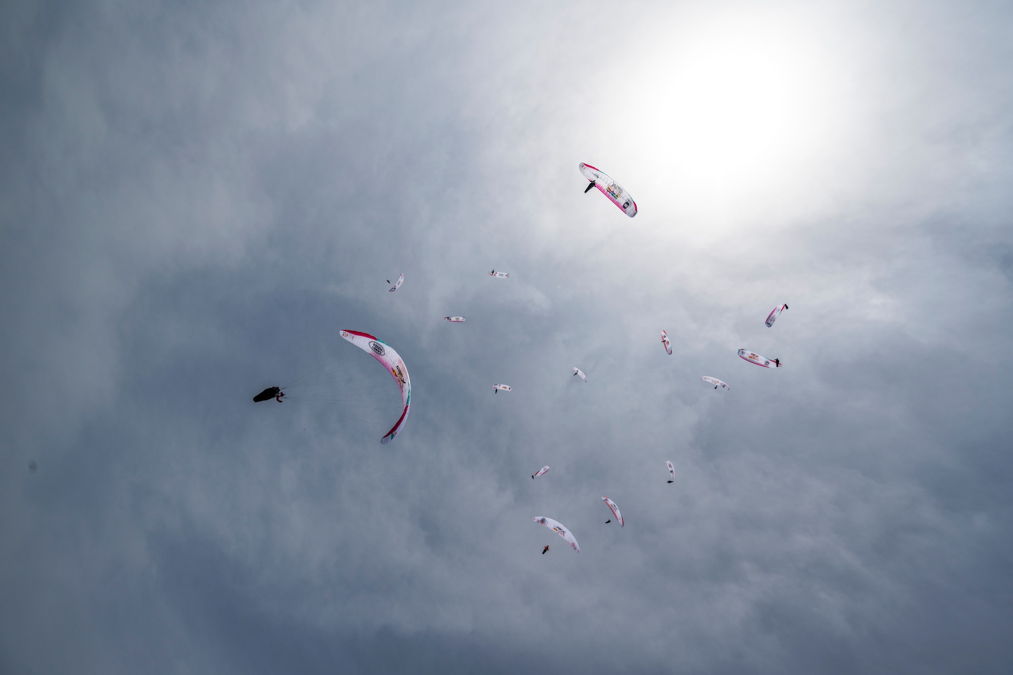 Athletes flying during Red Bull X-Alps on Gaisberg, Austria on June 20, 2021
