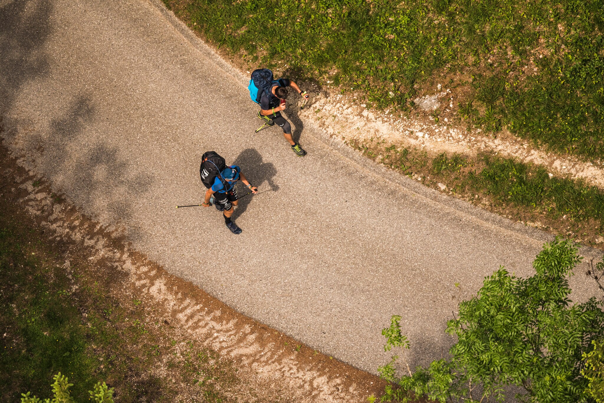 Christian Maurer (SUI1) and Paul Guschlbauer (AUT1) hike during the Red Bull X-Alps in Aschau, Germany on June 17, 2019.