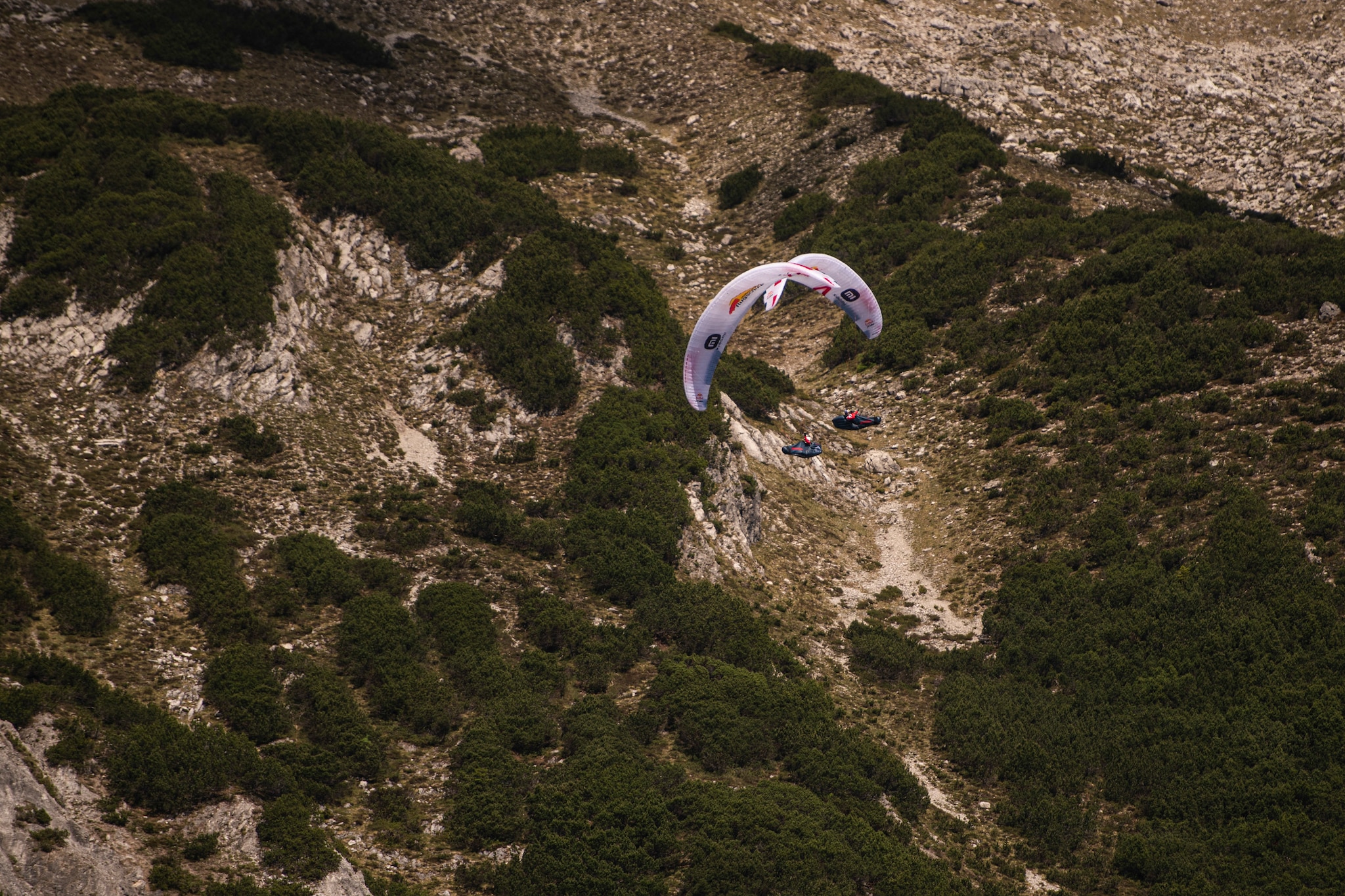 Paul Guschlbauer (AUT1) and Simon Oberrauner (AUT2) performing during the Red Bull X-Alps in Montafon / Austria on 23-June-2021. In this endurance adventure race athletes from 18 nations have to fly with paragliders or hike from Salzburg along the alps towards France, around the Mont Blanc back to Salzburg.