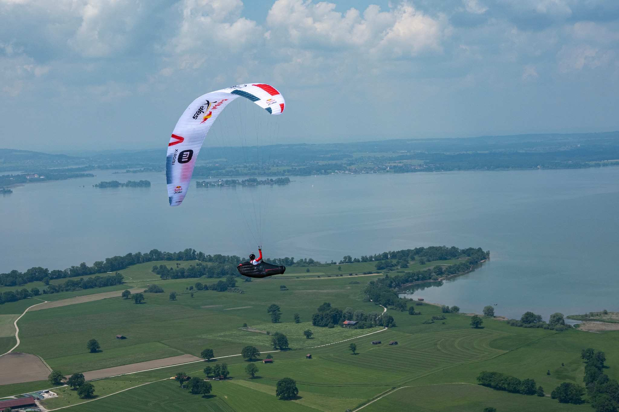 Participant flies during the Red Bull X-Alps preparations at Achendelta, Chiemsee, Germany on June 09, 2021