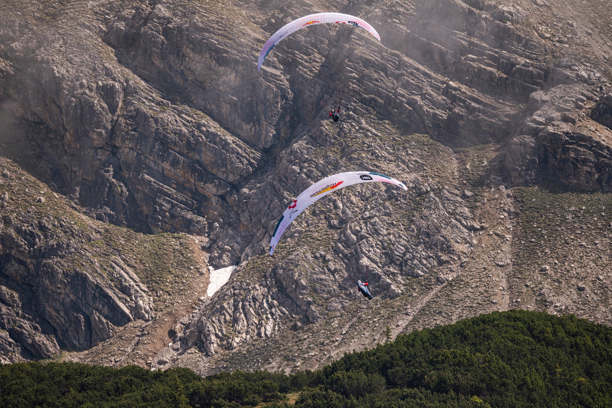 Paul Guschlbauer (AUT1) and Simon Oberrauner (AUT2) performing during the Red Bull X-Alps in Montafon / Austria on 23-June-2021. In this endurance adventure race athletes from 18 nations have to fly with paragliders or hike from Salzburg along the alps towards France, around the Mont Blanc back to Salzburg.
