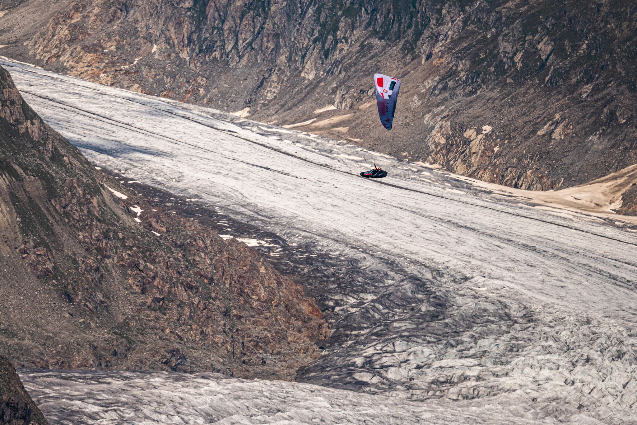 Paul Guschlbauer (AUT1) flying over Fiesch, Bettmeralp / Switzerland on 25-June-2021.