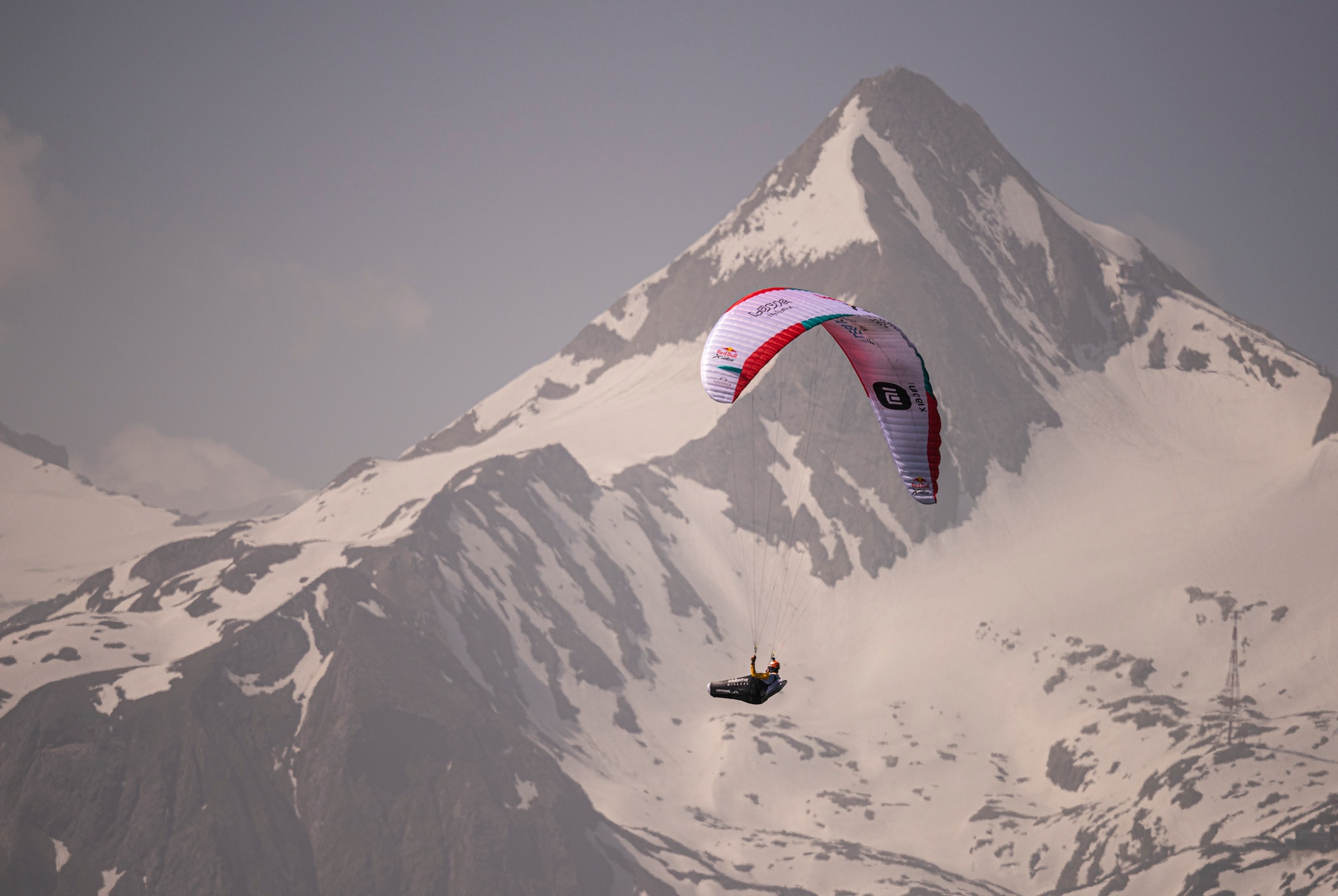 Chrigl Maurer (SUI1) races in front of the Kitzsteinhorn prior to the Red Bull X-Alps in Salzburg on June 21, 2021.
