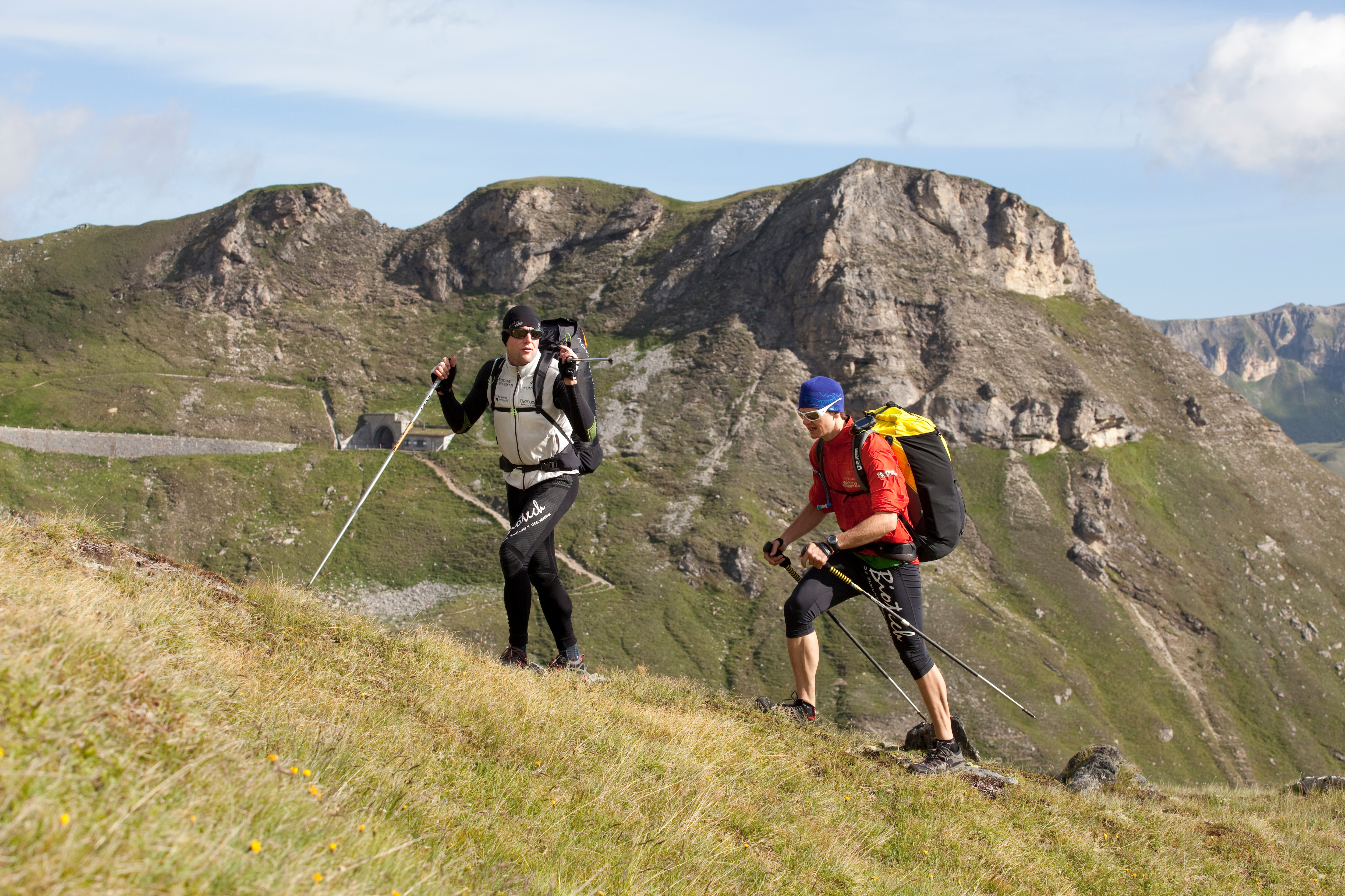 Christian Maurer (SUI1) - Paul Guschlbauer (AUT4) are hiking, and are reaching the Grossglockner pass,  Austria on 19th of july, 2011